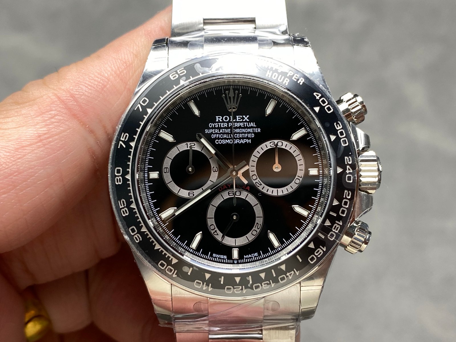 Product photograph 1 of 3: steel chronograph with a black dial, light counter rings, two pushers beside the crown and a black tachymeter bezel