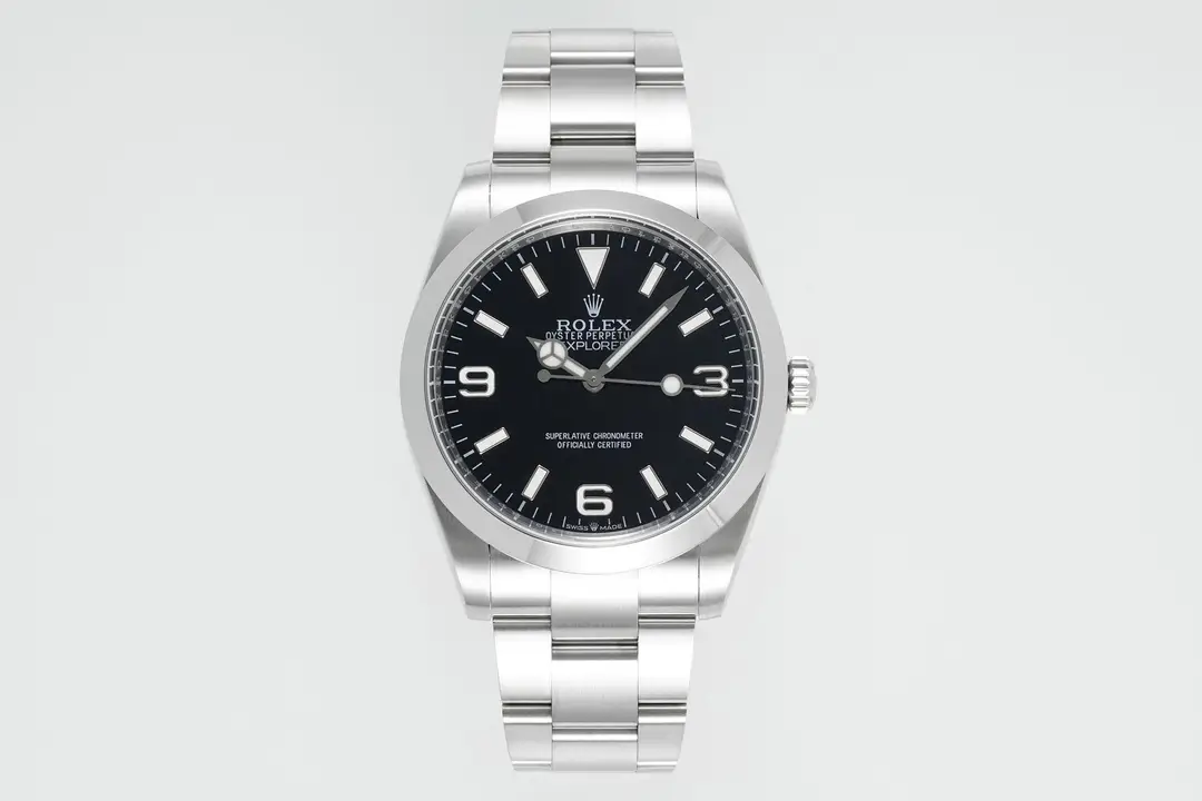 Reference photograph of a silver-tone watch with a black dial and a smooth bezel
