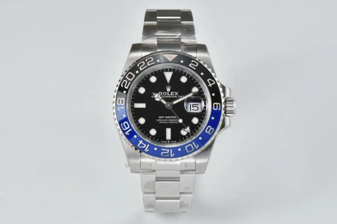 Reference photograph of a silver-tone watch with a black dial and a blue-and-black 24-hour bezel