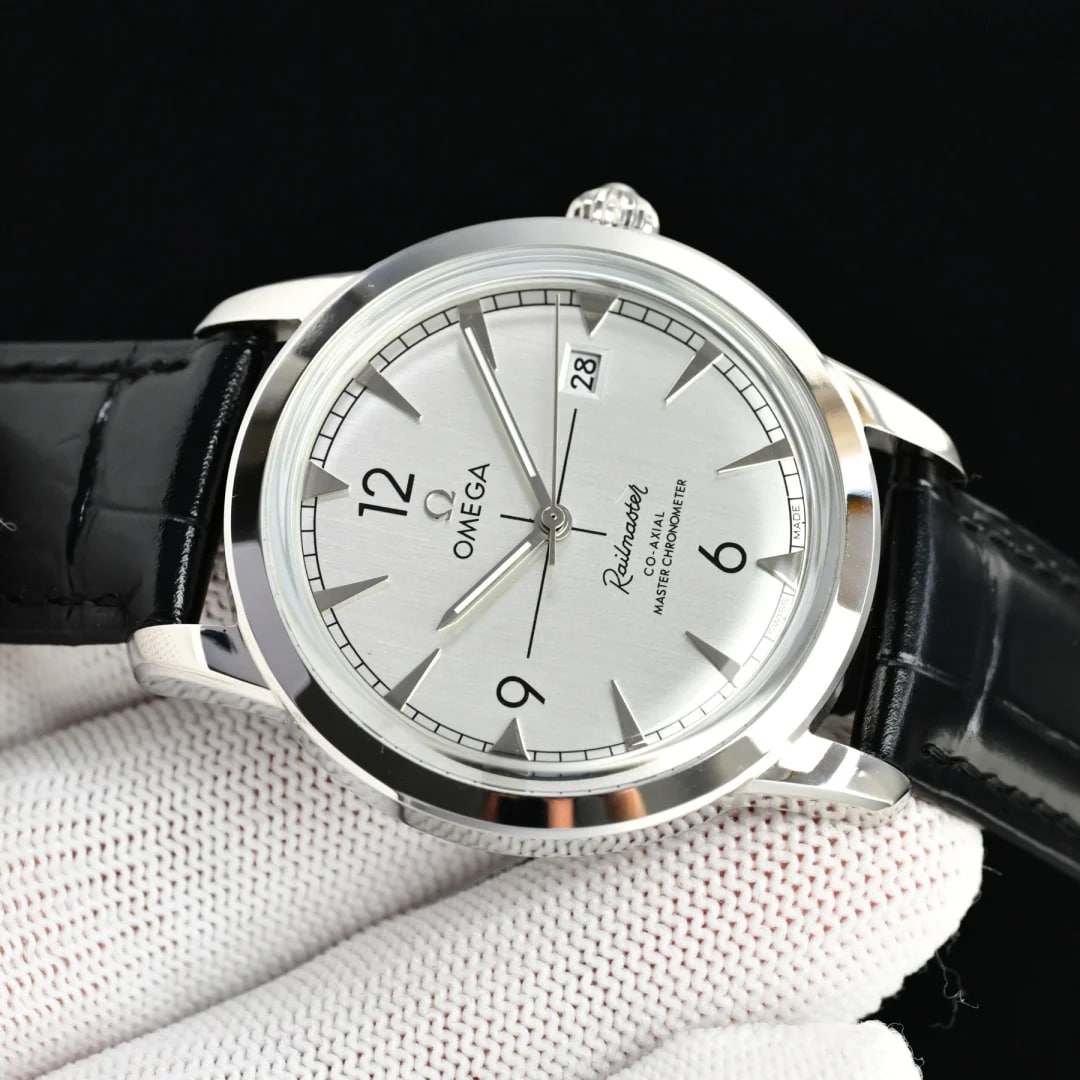 Angled three-quarter view of the case and strap: the smooth polished rim and the crown at the right, the brushed dial turned away with its printed crossing lines, and the black leather strap leaving both lugs