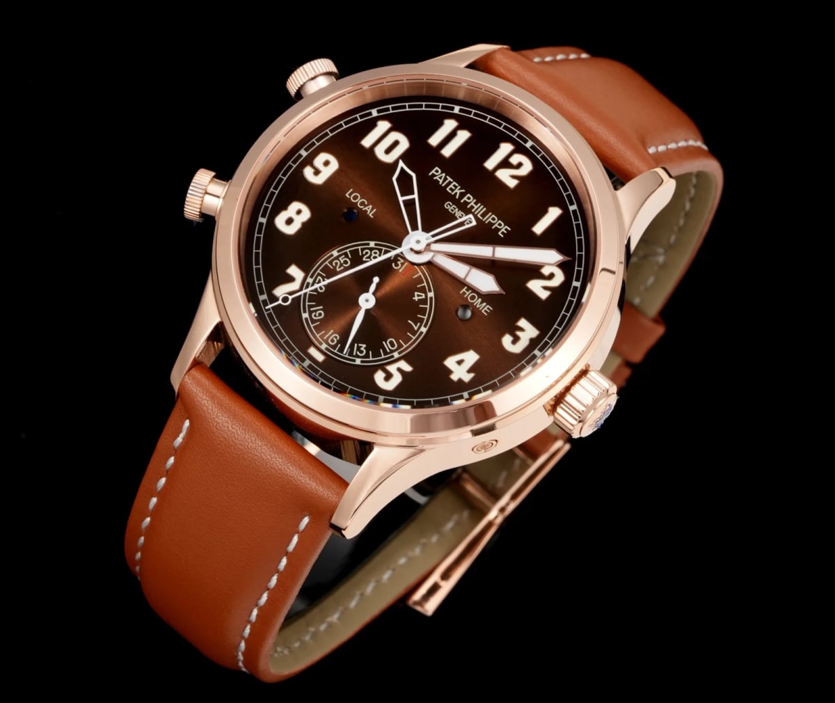 Three-quarter view of the gold-tone case on its brown leather strap, the dial turned away so the numeral ring and the date subdial above six o’clock read at an angle