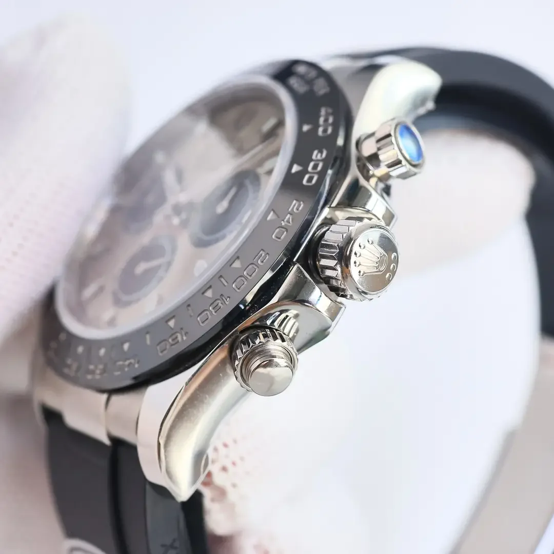 Three-quarter view along the case flank showing the crown between its two pushers, the black bezel edge and the curve of the rubber strap