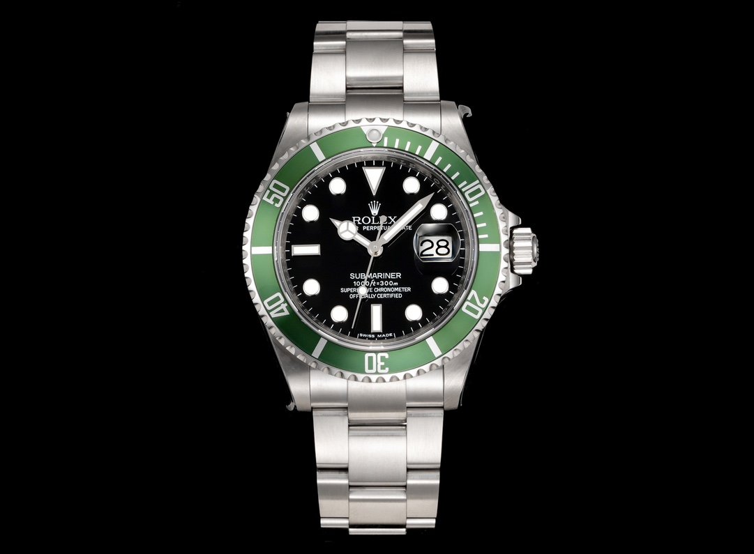 Product photograph 1 of 3: dive watch with a black dial, a green sixty-minute bezel and the date under a magnifying lens
