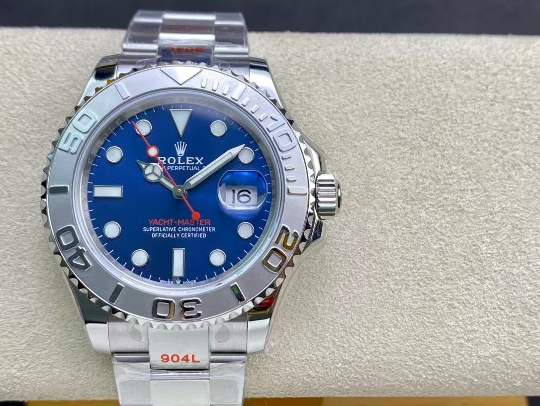 Reference photograph of a silver-tone watch with a blue dial, a bezel carrying raised numerals and a three-link bracelet